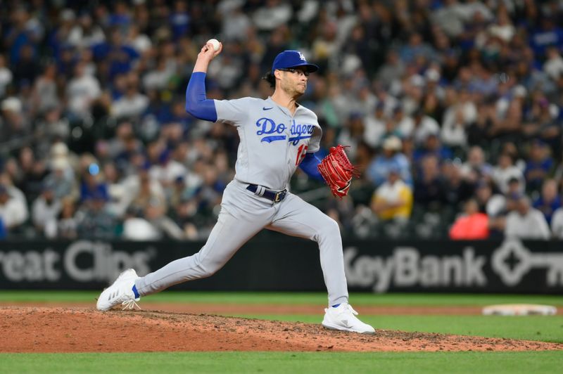 Sep 16, 2023; Seattle, Washington, USA; Los Angeles Dodgers relief pitcher Joe Kelly (17) pitches to the Seattle Mariners during the eleventh inning at T-Mobile Park. Mandatory Credit: Steven Bisig-USA TODAY Sports