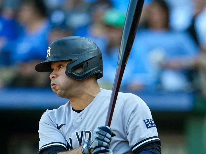 Oct 1, 2023; Kansas City, Missouri, USA; New York Yankees third baseman Isiah Kiner-Falefa (12) hits an RBI single during the sixth inning against the Kansas City Royals at Kauffman Stadium. Mandatory Credit: Jay Biggerstaff-USA TODAY Sports