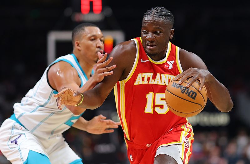 ATLANTA, GEORGIA - APRIL 10:  Clint Capela #15 of the Atlanta Hawks drives against Grant Williams #2 of the Charlotte Hornets during the first quarter at State Farm Arena on April 10, 2024 in Atlanta, Georgia.  NOTE TO USER: User expressly acknowledges and agrees that, by downloading and/or using this photograph, user is consenting to the terms and conditions of the Getty Images License Agreement.  (Photo by Kevin C. Cox/Getty Images)