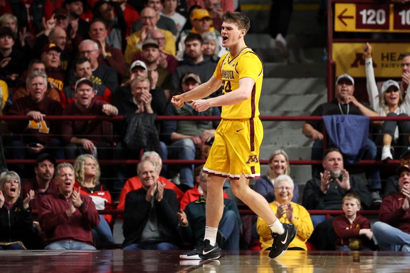 Mar 5, 2025; Minneapolis, Minnesota, USA; Minnesota Golden Gophers guard Brennan Rigsby (24) celebrates his basket against the Wisconsin Badgers during the second half at Williams Arena. Mandatory Credit: Matt Krohn-Imagn Images