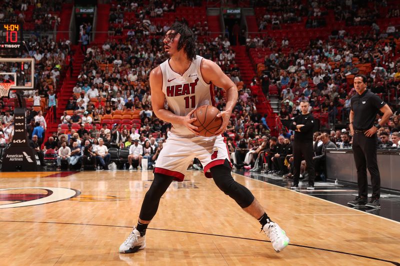 MIAMI, FL - APRIL 12:  Jaime Jaquez Jr. #11 of the Miami Heat handles the ball during the game against the Toronto Raptors on April 12, 2024 at Kaseya Center in Miami, Florida. NOTE TO USER: User expressly acknowledges and agrees that, by downloading and or using this Photograph, user is consenting to the terms and conditions of the Getty Images License Agreement. Mandatory Copyright Notice: Copyright 2024 NBAE (Photo by Issac Baldizon/NBAE via Getty Images)