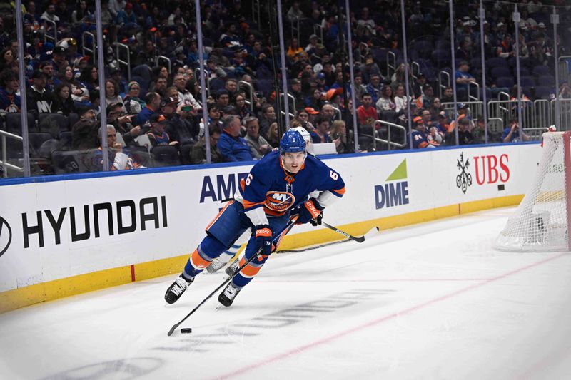 Mar 23, 2024; Elmont, New York, USA;  New York Islanders defenseman Ryan Pulock (6) skates with the puck against the Winnipeg Jets during the first period at UBS Arena. Mandatory Credit: Dennis Schneidler-USA TODAY Sports