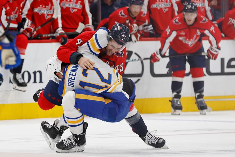 Nov 22, 2023; Washington, District of Columbia, USA; Washington Capitals right wing Tom Wilson (43) fights Buffalo Sabres left wing Jordan Greenway (12) in the first period at Capital One Arena. Mandatory Credit: Geoff Burke-USA TODAY Sports