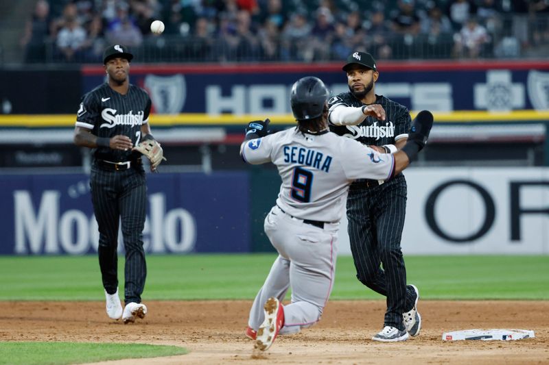 Jun 9, 2023; Chicago, Illinois, USA; Chicago White Sox shortstop Elvis Andrus (1) throws out Miami Marlins third baseman Jean Segura (9) at second base during the fifth inning at Guaranteed Rate Field. Mandatory Credit: Kamil Krzaczynski-USA TODAY Sports