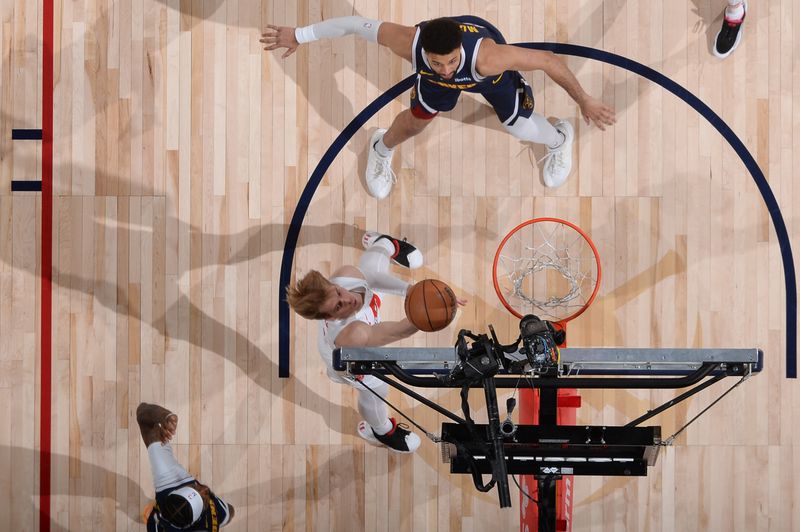 DENVER, CO - MARCH 11: Gradey Dick #1 of the Toronto Raptors shoots the ball during the game against the Denver Nuggets on March 11, 2024 at the Ball Arena in Denver, Colorado. NOTE TO USER: User expressly acknowledges and agrees that, by downloading and/or using this Photograph, user is consenting to the terms and conditions of the Getty Images License Agreement. Mandatory Copyright Notice: Copyright 2024 NBAE (Photo by Bart Young/NBAE via Getty Images)