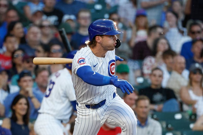 Jun 5, 2024; Chicago, Illinois, USA; Chicago Cubs second baseman Nico Hoerner (2) hits an RBI-single against the Chicago White Sox during the second inning at Wrigley Field. Mandatory Credit: Kamil Krzaczynski-USA TODAY Sports