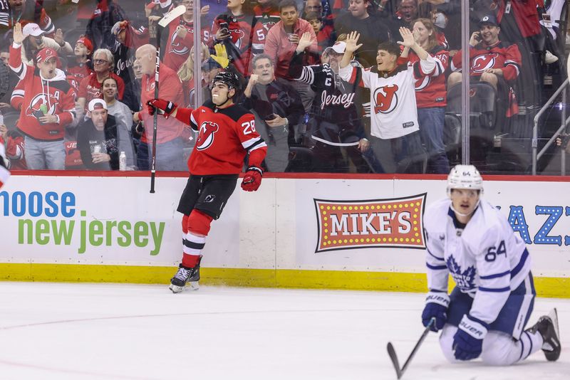 Oct 10, 2024; Newark, New Jersey, USA; New Jersey Devils right wing Timo Meier (28) celebrates his goal against the Toronto Maple Leafs during the second period at Prudential Center. Mandatory Credit: Ed Mulholland-Imagn Images