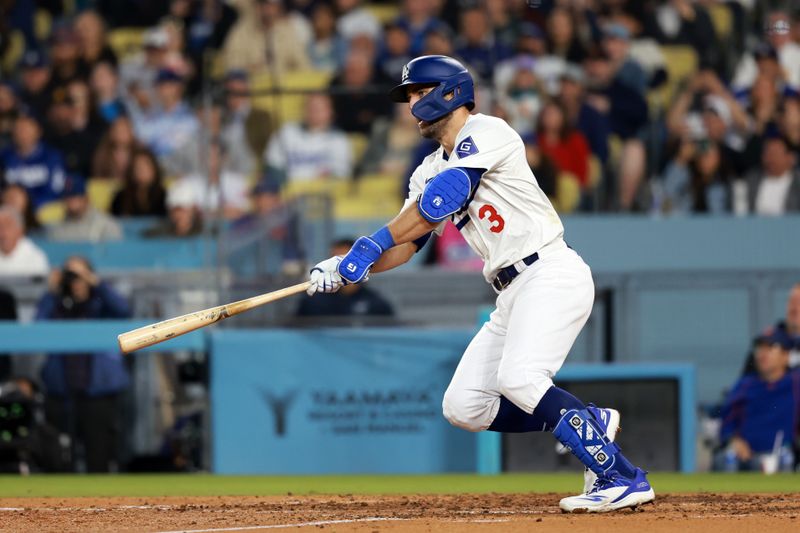 Apr 19, 2024; Los Angeles, California, USA;  Los Angeles Dodgers outfielder Chris Taylor (3) hits an RBI single during the sixth inning against the New York Mets at Dodger Stadium. Mandatory Credit: Kiyoshi Mio-USA TODAY Sports