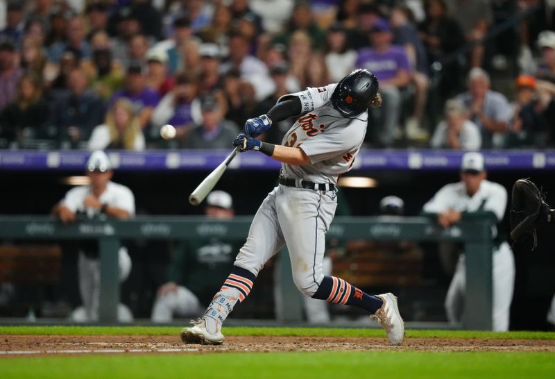 Jul 1, 2023; Denver, Colorado, USA; Detroit Tigers second baseman Zach McKinstry (39) hits a three run home run in the tenth inning against the Colorado Rockies at Coors Field. Mandatory Credit: Ron Chenoy-USA TODAY Sports