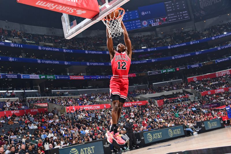 LOS ANGELES, CA - MARCH 9: Ayo Dosunmu #12 of the Chicago Bulls dunks the ball during the game against the LA Clippers on March 9, 2024 at Crypto.Com Arena in Los Angeles, California. NOTE TO USER: User expressly acknowledges and agrees that, by downloading and/or using this Photograph, user is consenting to the terms and conditions of the Getty Images License Agreement. Mandatory Copyright Notice: Copyright 2024 NBAE (Photo by Adam Pantozzi/NBAE via Getty Images)