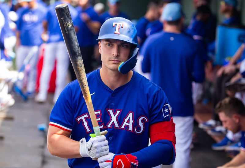 Mar 18, 2024; Surprise, Arizona, USA; Texas Rangers designated hitter Justin Foscue against the Seattle Mariners during a spring training baseball game at Surprise Stadium. Mandatory Credit: Mark J. Rebilas-USA TODAY Sports