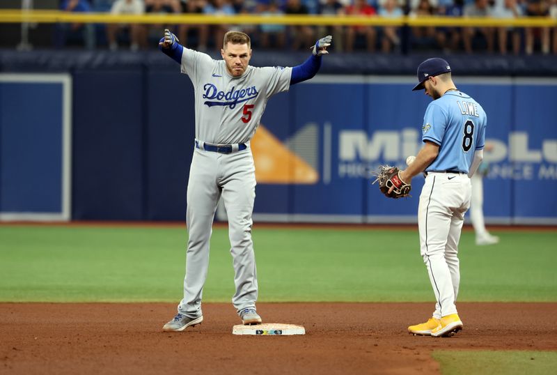 May 28, 2023; St. Petersburg, Florida, USA; Los Angeles Dodgers first baseman Freddie Freeman (5) doubles during the fourth inning against the Tampa Bay Rays at Tropicana Field. Mandatory Credit: Kim Klement-USA TODAY Sports