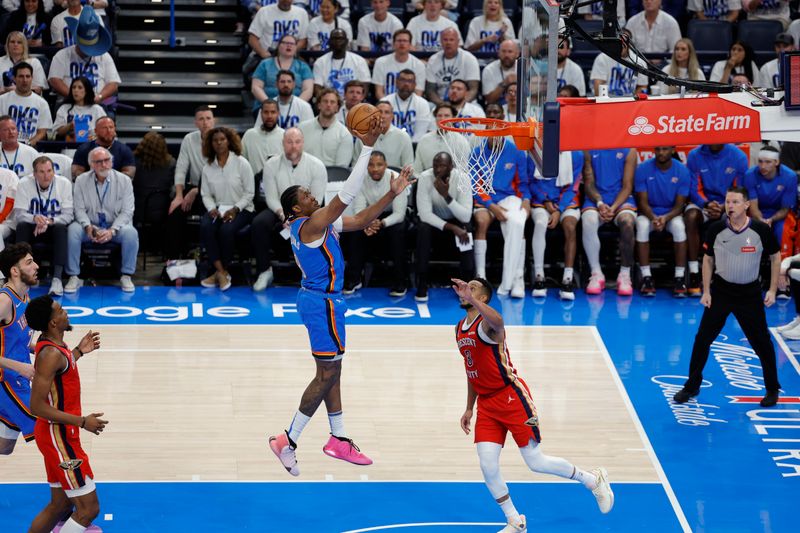 OKLAHOMA CITY, OK - APRIL 24: Jalen Williams #8 of the Oklahoma City Thunder drives to the basket during the game against the New Orleans Pelicans during Round 1 Game 2 of the 2024 NBA Playoffs on April 24, 2024 at Paycom Arena in Oklahoma City, Oklahoma. NOTE TO USER: User expressly acknowledges and agrees that, by downloading and or using this photograph, User is consenting to the terms and conditions of the Getty Images License Agreement. Mandatory Copyright Notice: Copyright 2024 NBAE (Photo by Martin McGrew/NBAE via Getty Images)