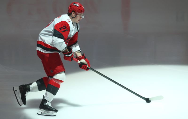 Mar 22, 2026; Pittsburgh, Pennsylvania, USA;  Carolina Hurricanes defenseman Alexander Nikishin (21) takes the ice to warm up against the Pittsburgh Penguins at PPG Paints Arena. Mandatory Credit: Charles LeClaire-Imagn Images