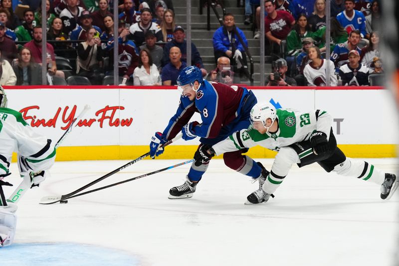 May 17, 2024; Denver, Colorado, USA; Dallas Stars defenseman Esa Lindell (23) and Colorado Avalanche defenseman Cale Makar (8) battle for the puck in the second period in game six of the second round of the 2024 Stanley Cup Playoffs at Ball Arena. Mandatory Credit: Ron Chenoy-USA TODAY Sports