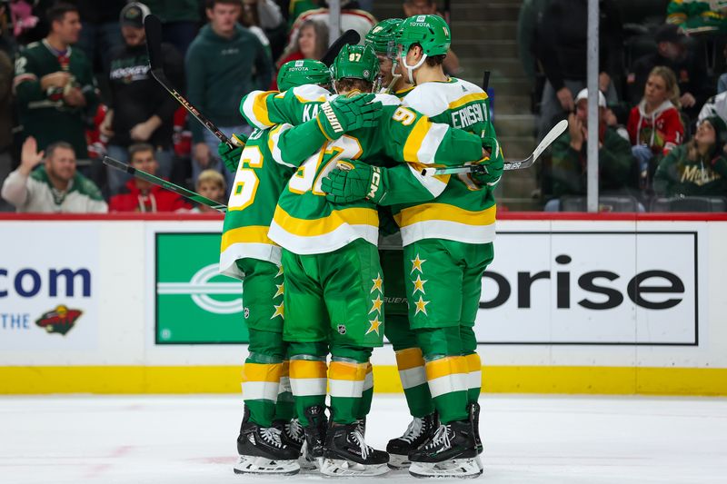 Dec 3, 2023; Saint Paul, Minnesota, USA; Minnesota Wild left wing Matt Boldy (12) celebrates his goal during a power play with right wing Mats Zuccarello (36) and center Joel Eriksson Ek (14) during the second period against the Chicago Blackhawks at Xcel Energy Center. Mandatory Credit: Matt Krohn-USA TODAY Sports