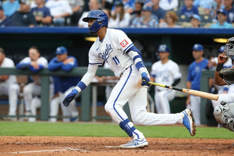 Jul 20, 2024; Kansas City, Missouri, USA; Kansas City Royals third baseman Maikel Garcia (11) lines out to shortstop against the Chicago White Sox during the seventh inning at Kauffman Stadium. Mandatory Credit: Scott Sewell-USA TODAY Sports