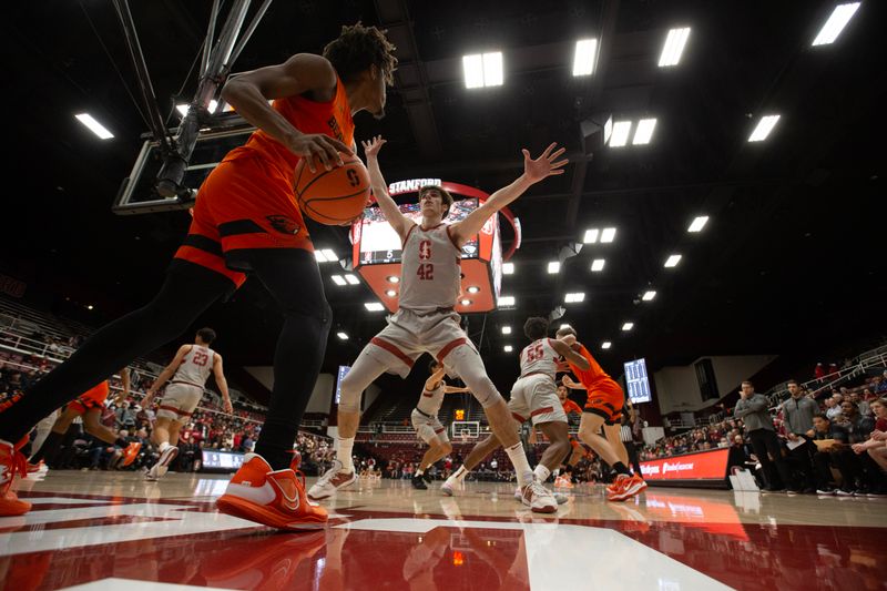 Jan 19, 2023; Stanford, California, USA; Oregon State Beavers forward Glenn Taylor Jr. (35) looks for an open teammate while inbounding past Stanford Cardinal forward Maxime Raynaud (42) during the first half at Maples Pavilion. Mandatory Credit: D. Ross Cameron-USA TODAY Sports