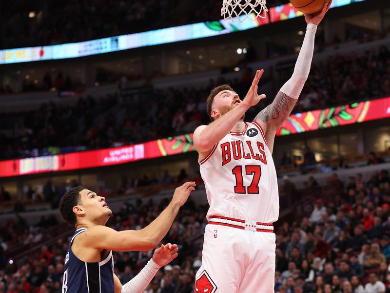 CHICAGO, ILLINOIS - MARCH 11: Onuralp Bitim #17 of the Chicago Bulls goes up for a layup against Josh Green #8 of the Dallas Mavericks during the second half at the United Center on March 11, 2024 in Chicago, Illinois. NOTE TO USER: User expressly acknowledges and agrees that, by downloading and or using this photograph, User is consenting to the terms and conditions of the Getty Images License Agreement.  (Photo by Michael Reaves/Getty Images)