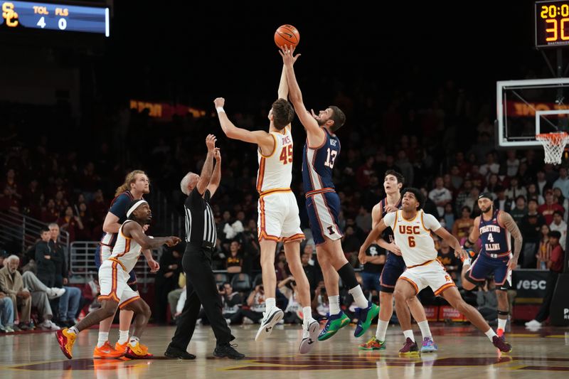 Feb 18, 2026; Los Angeles, California, USA; The opening tipoff between Illinois Fighting Illini center Tomislav Ivisic (13) and Southern California Trojans center Gabe Dynes (45) at the Galen Center. Mandatory Credit: Kirby Lee-Imagn Images