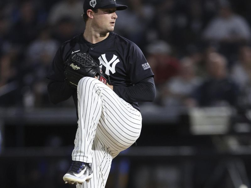 Mar 1, 2024; Tampa, Florida, USA;  New York Yankees starting pitcher Gerrit Cole (45) throws a pitch against the Toronto Blue Jays in the first inning at George M. Steinbrenner Field. Mandatory Credit: Nathan Ray Seebeck-USA TODAY Sports