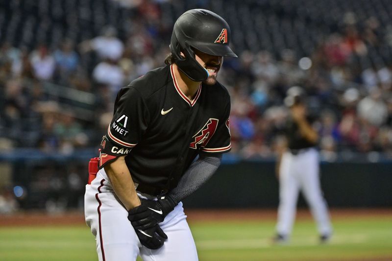 Sep 6, 2023; Phoenix, Arizona, USA; Arizona Diamondbacks left fielder Corbin Carroll (7) reacts after being hit in the hand with a pitch in the fourth inning against the Colorado Rockies at Chase Field. Mandatory Credit: Matt Kartozian-USA TODAY Sports