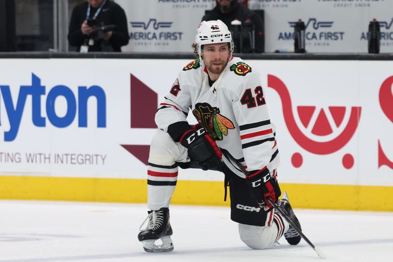 Feb 25, 2025; Salt Lake City, Utah, USA; Chicago Blackhawks defenseman Nolan Allan (42) prepares for the game against the Utah Hockey Club at Delta Center. Mandatory Credit: Rob Gray-Imagn Images