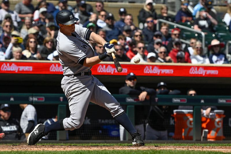 Apr 26, 2023; Minneapolis, Minnesota, USA; New York Yankees infielder DJ LeMahieu (26) drives in a run on a sacrifice fly against the Minnesota Twins during the seventh inning at Target Field. Mandatory Credit: Nick Wosika-USA TODAY Sports

