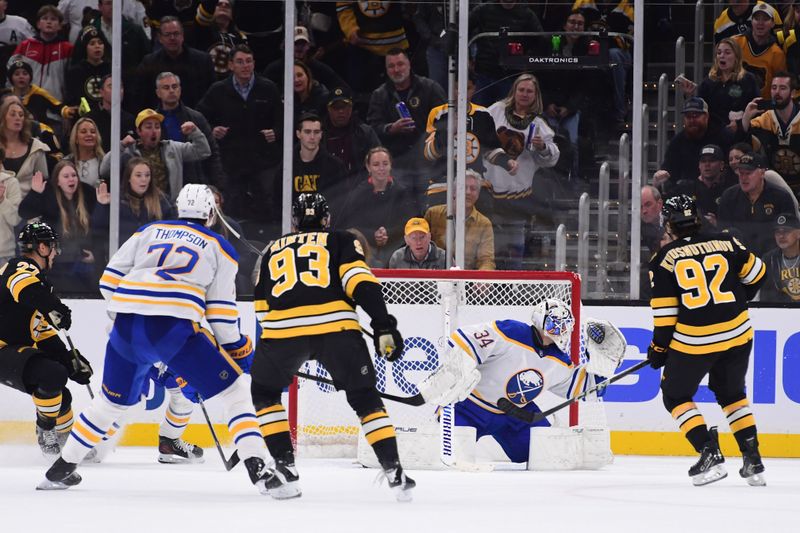 Oct 30, 2025; Boston, Massachusetts, USA;  Boston Bruins center Marat Khusnutdinov (92) scores the overtime winning goal past Buffalo Sabres goaltender Alex Lyon (34) at TD Garden. Mandatory Credit: Bob DeChiara-Imagn Images