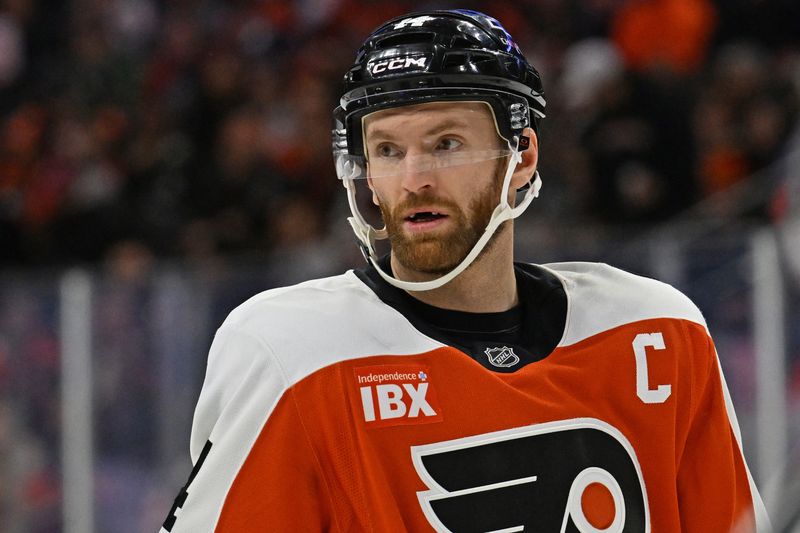 Nov 12, 2025; Philadelphia, Pennsylvania, USA; Philadelphia Flyers center Sean Couturier (14) against the Edmonton Oilers during the first period at Xfinity Mobile Arena. Mandatory Credit: Eric Hartline-Imagn Images