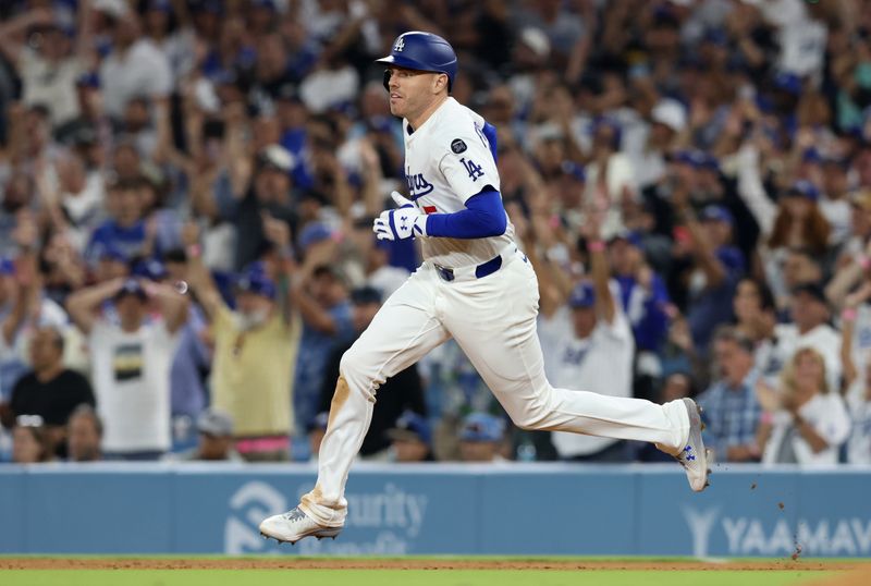 May 30, 2025; Los Angeles, California, USA; Los Angeles Dodgers first baseman Freddie Freeman (5) runs to second on a RBI double during the sixth inning against the New York Yankees at Dodger Stadium. Mandatory Credit: Jason Parkhurst-Imagn Images