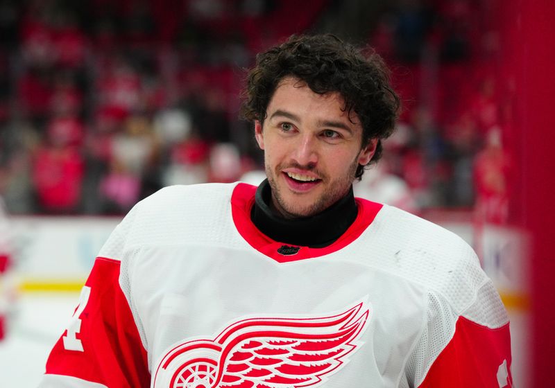 Jan 19, 2024; Raleigh, North Carolina, USA; Detroit Red Wings goaltender Alex Lyon (34) smiles during the warmups before the game against the Carolina Hurricanes at PNC Arena. Mandatory Credit: James Guillory-USA TODAY Sports