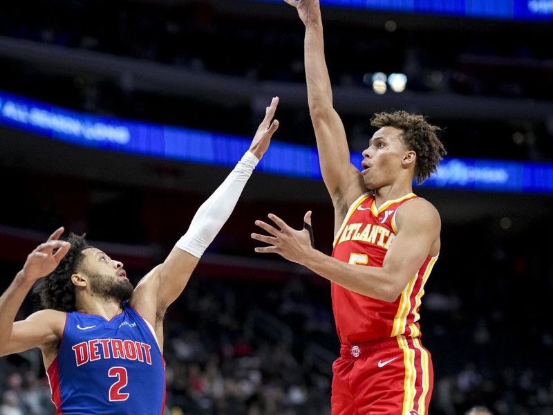 DETROIT, MICHIGAN - NOVEMBER 08: Dyson Daniels #5 of the Atlanta Hawks shoots the ball against Cade Cunningham #2 of the Detroit Pistons during the first quarter at Little Caesars Arena on November 08, 2024 in Detroit, Michigan. NOTE TO USER: User expressly acknowledges and agrees that, by downloading and or using this photograph, User is consenting to the terms and conditions of the Getty Images License Agreement. (Photo by Nic Antaya/Getty Images)