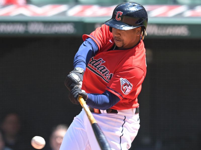 Apr 26, 2023; Cleveland, Ohio, USA; Cleveland Guardians third baseman Jose Ramirez (11) hits a double during the third inning against the Colorado Rockies at Progressive Field. Mandatory Credit: Ken Blaze-USA TODAY Sports