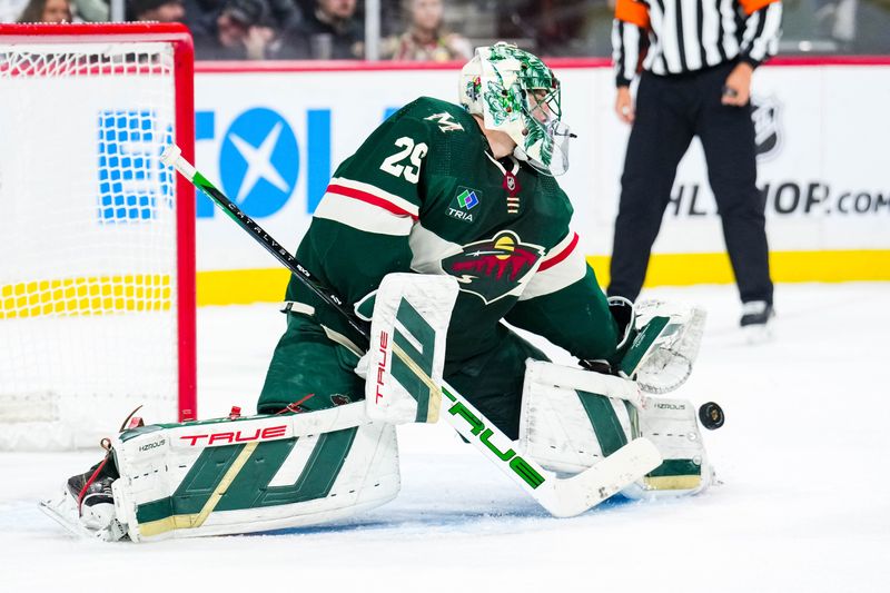 Jan 2, 2024; Saint Paul, Minnesota, USA; Minnesota Wild goaltender Marc-Andre Fleury (29) makes a save during the first period against the Calgary Flames at Xcel Energy Center. Mandatory Credit: Brace Hemmelgarn-USA TODAY Sports