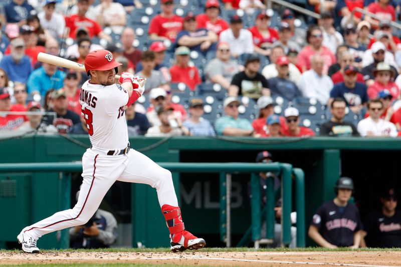 Apr 16, 2023; Washington, District of Columbia, USA; Washington Nationals right fielder Lane Thomas (28) hits an RBI double against the Cleveland Guardians during the second inning at Nationals Park. Mandatory Credit: Geoff Burke-USA TODAY Sports