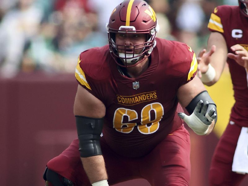 Washington Commanders center Tyler Larsen (69) blocks during an NFL football game against the Philadelphia Eagles, Sunday, October 29, 2023 in Landover, Maryland. (AP Photo/Daniel Kucin Jr.)