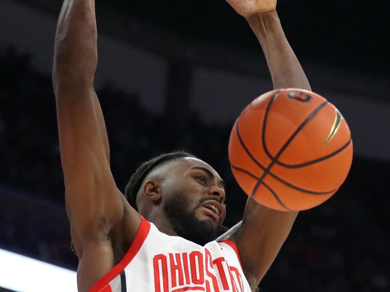 Jan 20, 2024; Columbus, Ohio, USA;  Ohio State Buckeyes guard Evan Mahaffey (12) dunks the ball during the second half against the Penn State Nittany Lions at Value City Arena. Mandatory Credit: Joseph Maiorana-USA TODAY Sports