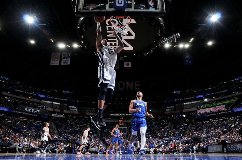 ORLANDO, FL - MARCH 30:  Brandon Clarke #15 of the Memphis Grizzlies drives to the basket during the game against the Orlando Magic on March 30, 2024 at the Kia Center in Orlando, Florida. NOTE TO USER: User expressly acknowledges and agrees that, by downloading and or using this photograph, User is consenting to the terms and conditions of the Getty Images License Agreement. Mandatory Copyright Notice: Copyright 2024 NBAE (Photo by Fernando Medina/NBAE via Getty Images)