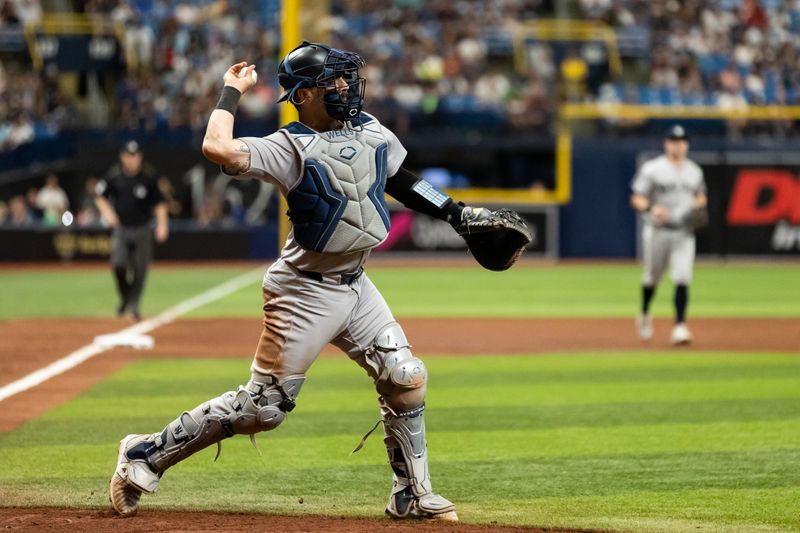 May 11, 2024; St. Petersburg, Florida, USA; New York Yankees catcher Austin Wells (28) throws the ball to first base against the Tampa Bay Rays during the fifth inning at Tropicana Field. Mandatory Credit: Matt Pendleton-USA TODAY Sports