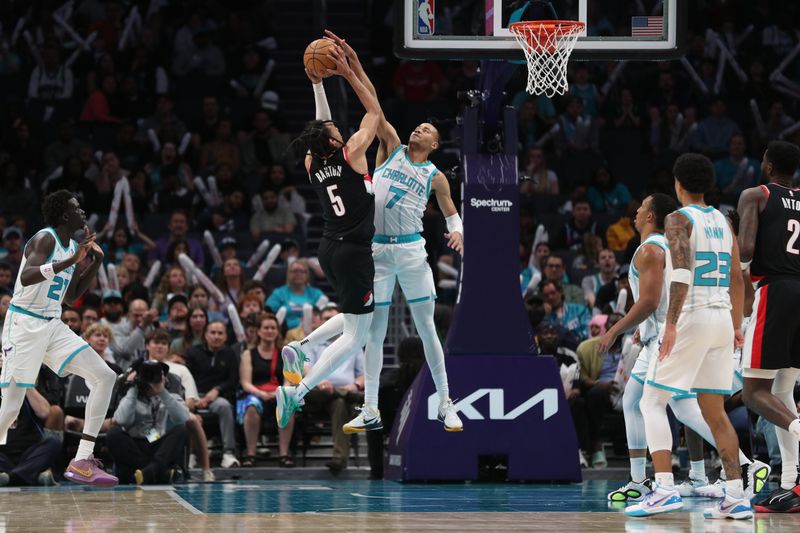 CHARLOTTE, NC - APRIL 3:  Bryce McGowans #7 of the Charlotte Hornets plays defense against Dalano Banton #5 of the Portland Trail Blazers on April 3, 2024 at Spectrum Center in Charlotte, North Carolina. NOTE TO USER: User expressly acknowledges and agrees that, by downloading and or using this photograph, User is consenting to the terms and conditions of the Getty Images License Agreement.  Mandatory Copyright Notice:  Copyright 2024 NBAE (Photo by Brock Williams-Smith/NBAE via Getty Images)