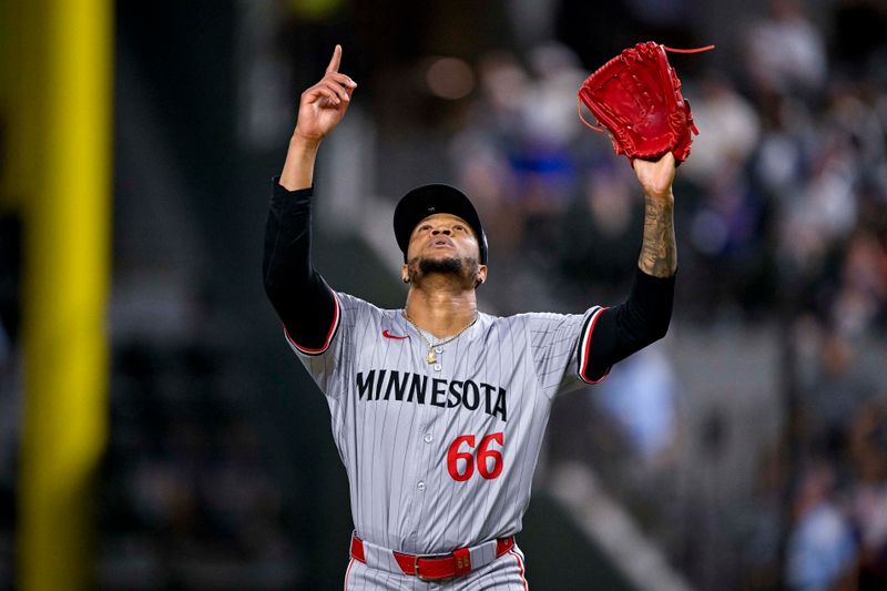 Aug 15, 2024; Arlington, Texas, USA; Minnesota Twins relief pitcher Jorge Alcala (66) raises his arms as he comes off the field after he pitches against the Texas Rangers during the eighth inning at Globe Life Field. Mandatory Credit: Jerome Miron-USA TODAY Sports