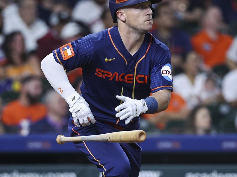 May 1, 2023; Houston, Texas, USA; Houston Astros third baseman Alex Bregman (2) hits an RBI single during the seventh inning against the San Francisco Giants at Minute Maid Park. Mandatory Credit: Troy Taormina-USA TODAY Sports