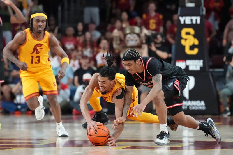 Jan 31, 2026; Los Angeles, California, USA; Southern California Trojans guard Chad Baker-Mazara (4) and Rutgers Scarlet Knights guard Tariq Francis (0) reach for the ball in the second half at Galen Center. Mandatory Credit: Kirby Lee-Imagn Images
