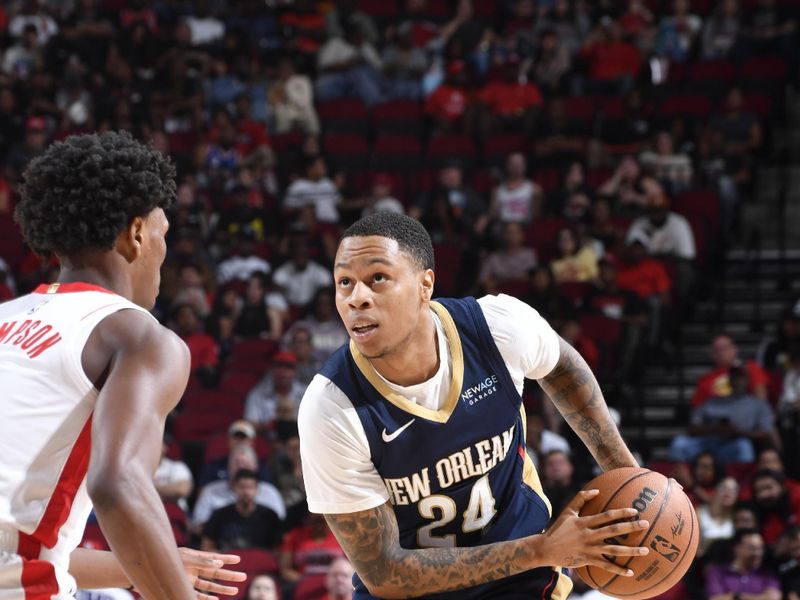 HOUSTON, TX - OCTOBER 15: Jordan Hawkins #24 of the New Orleans Pelicans handles the ball during the game against the Houston Rockets during a NBA preseason game on October 15, 2024 at the Toyota Center in Houston, Texas. NOTE TO USER: User expressly acknowledges and agrees that, by downloading and or using this photograph, User is consenting to the terms and conditions of the Getty Images License Agreement. Mandatory Copyright Notice: Copyright 2024 NBAE (Photo by Logan Riely/NBAE via Getty Images)