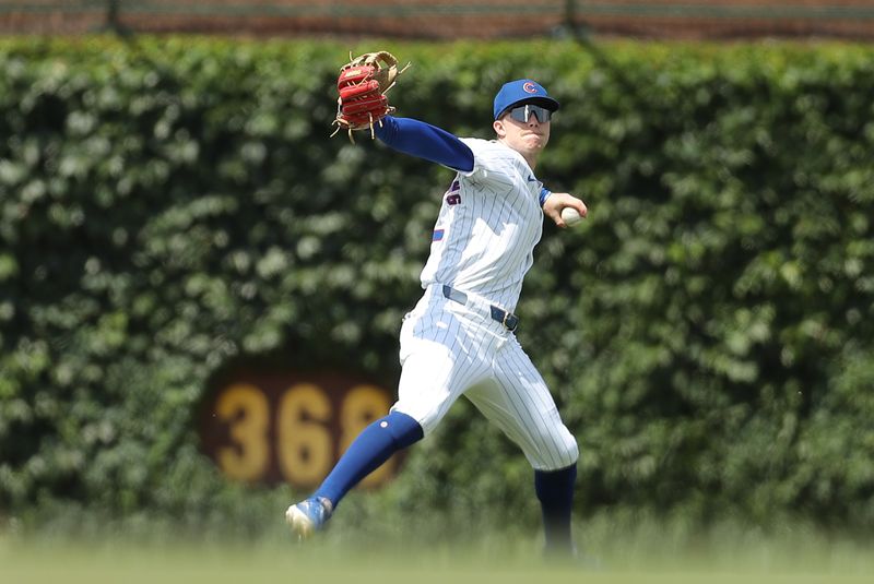 May 31, 2024; Chicago, Illinois, USA; Chicago Cubs outfielder Pete Crow-Armstrong (52) throws the ball to the infield during the fourth inning against the Cincinnati Reds at Wrigley Field. Mandatory Credit: Melissa Tamez-USA TODAY Sports