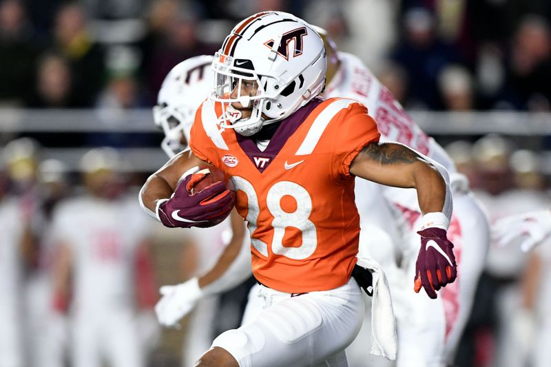 Nov 5, 2021; Chestnut Hill, Massachusetts, USA; Virginia Tech Hokies running back Chance Black (28) returns a ball against the Boston College Eagles during the first half at Alumni Stadium. Mandatory Credit: Brian Fluharty-USA TODAY Sports