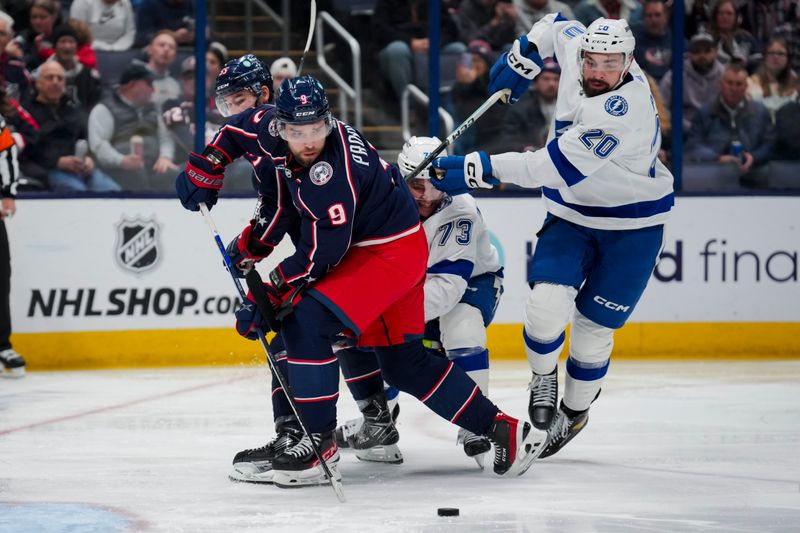 Nov 2, 2023; Columbus, Ohio, USA;  Columbus Blue Jackets defenseman Ivan Provorov (9) and defenseman David Jiricek (55) skate for the puck against Tampa Bay Lightning left wing Conor Sheary (73) and left wing Nicholas Paul (20) in the second period at Nationwide Arena. Mandatory Credit: Aaron Doster-USA TODAY Sports