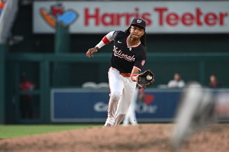 Aug 5, 2024; Washington, District of Columbia, USA; Washington Nationals shortstop CJ Abrams (5) fields a ground ball against the San Francisco Giants during the sixth inning at Nationals Park. Mandatory Credit: Rafael Suanes-USA TODAY Sports