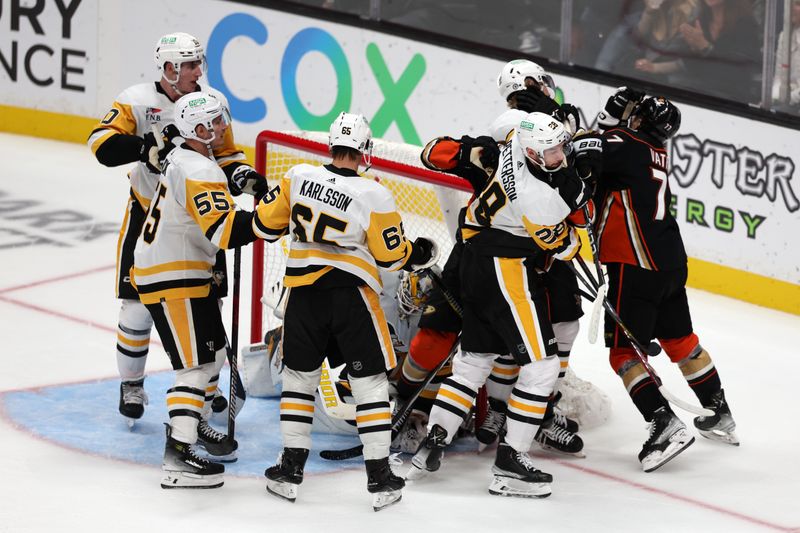 Nov 7, 2023; Anaheim, California, USA; Anaheim Ducks and Pittsburgh Penguins players push each other during the third period at Honda Center. Mandatory Credit: Kiyoshi Mio-USA TODAY Sports